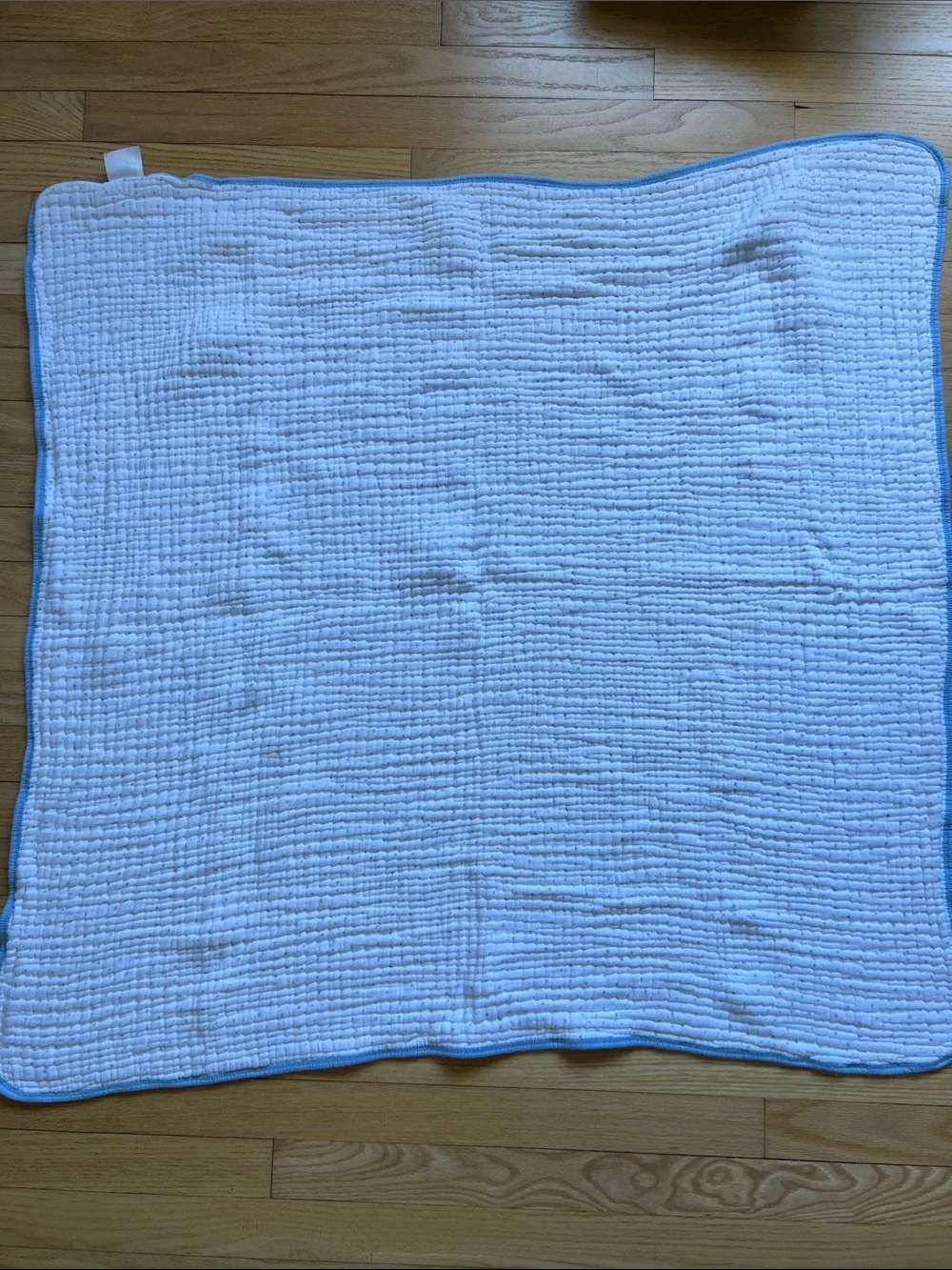 Aden + Anais Baby Muslin Blanket in White space print with Blue Trim